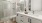 a bathroom with a tub twin sinks and toilet